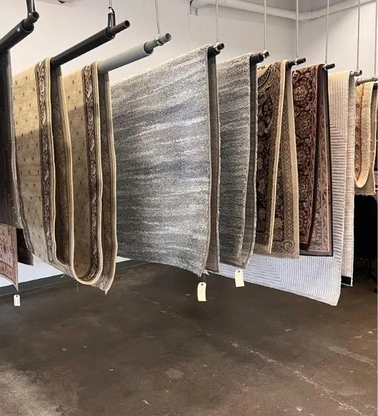 Hanging rugs displayed in a showroom