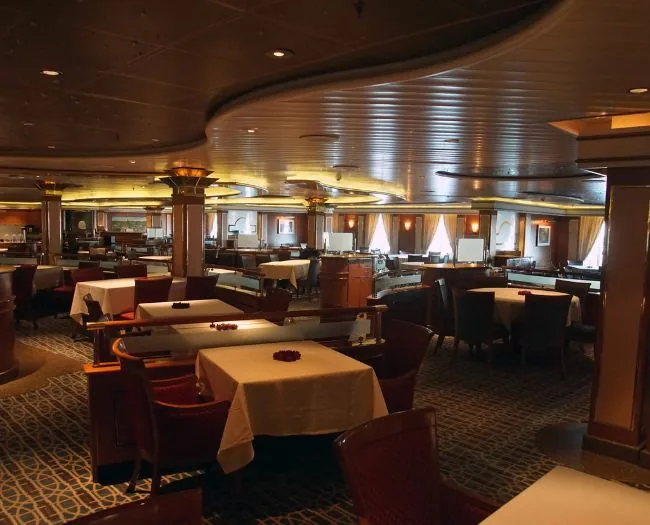 Elegant dining room with empty tables.