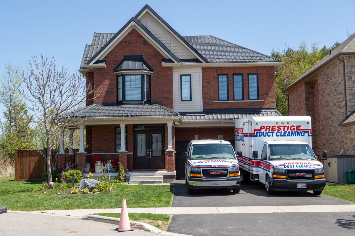 Prestige Carpet Cleaning van parked outside house in Durham