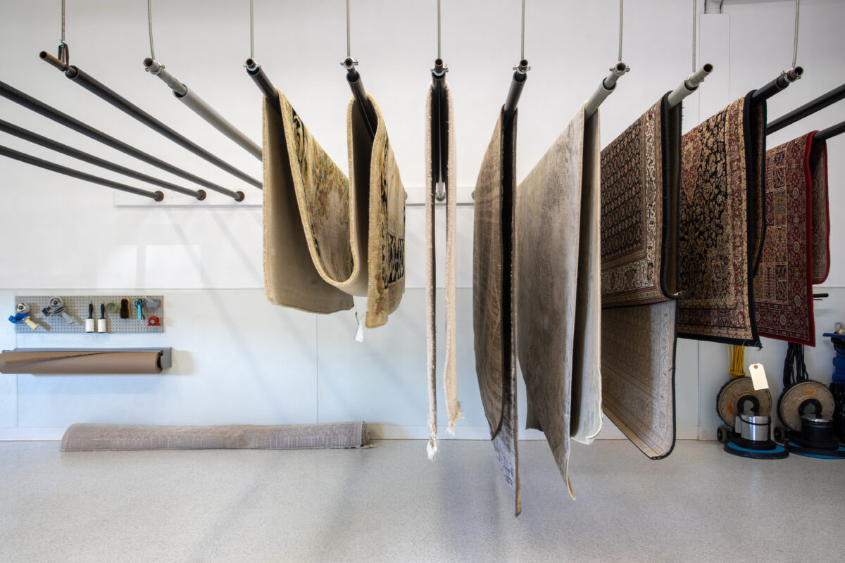 area rug cleaning at prestige ★ Prestige Carpet Cleaning Professional area rug cleaning at Prestige Carpet Cleaners - rugs hanging to dry